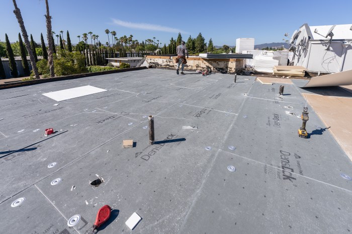 Why Expertise Matters in Flat and Commercial Roofing Installation | HER ...